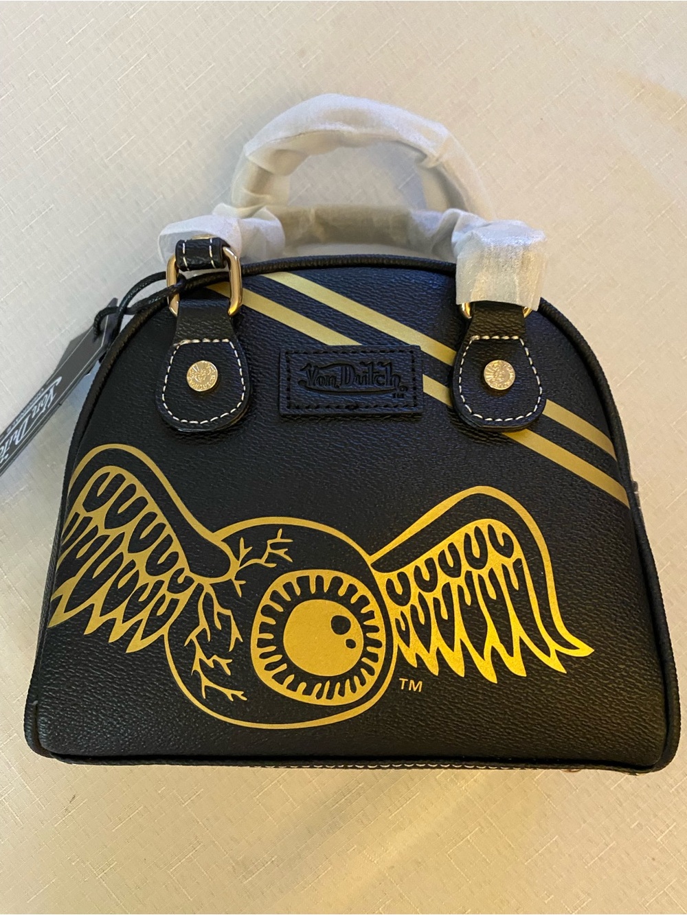 Von Dutch Black Bowling Bag with Gold Winged Eyeball Graphic and Racing Stipe